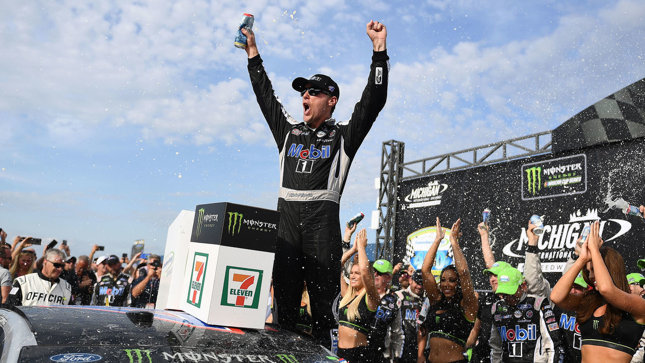 BROOKLYN, MICHIGAN - AUGUST 11: Kevin Harvick, driver of the #4 Mobil 1 Ford, celebrates in Victory Lane after winning the Monster Energy NASCAR Cup Series Consumers Energy 400 at Michigan International Speedway on August 11, 2019 in Brooklyn, Michigan.