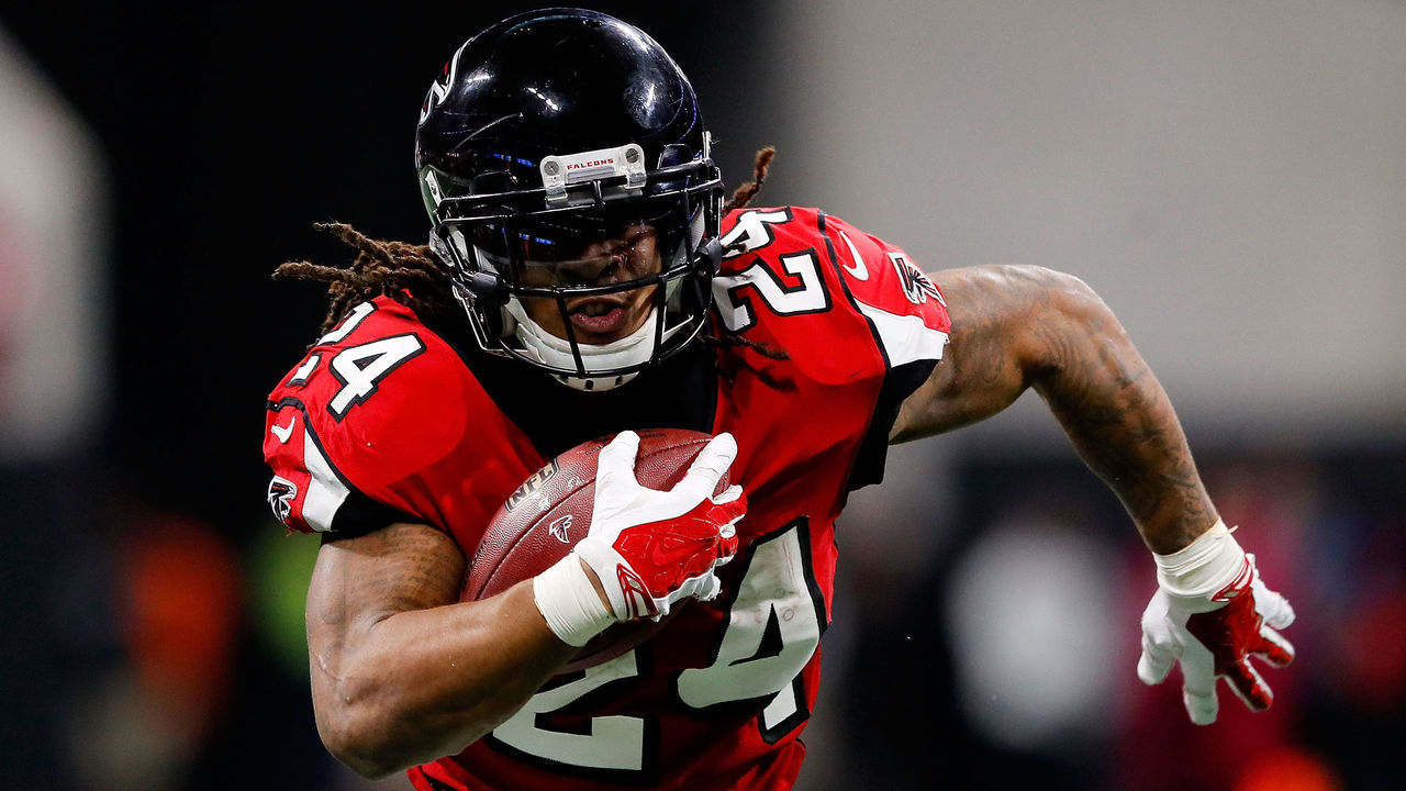 ATLANTA, GA - DECEMBER 31: Devonta Freeman #24 of the Atlanta Falcons runs the ball during the second half against the Carolina Panthers at Mercedes-Benz Stadium on December 31, 2017 in Atlanta, Georgia.