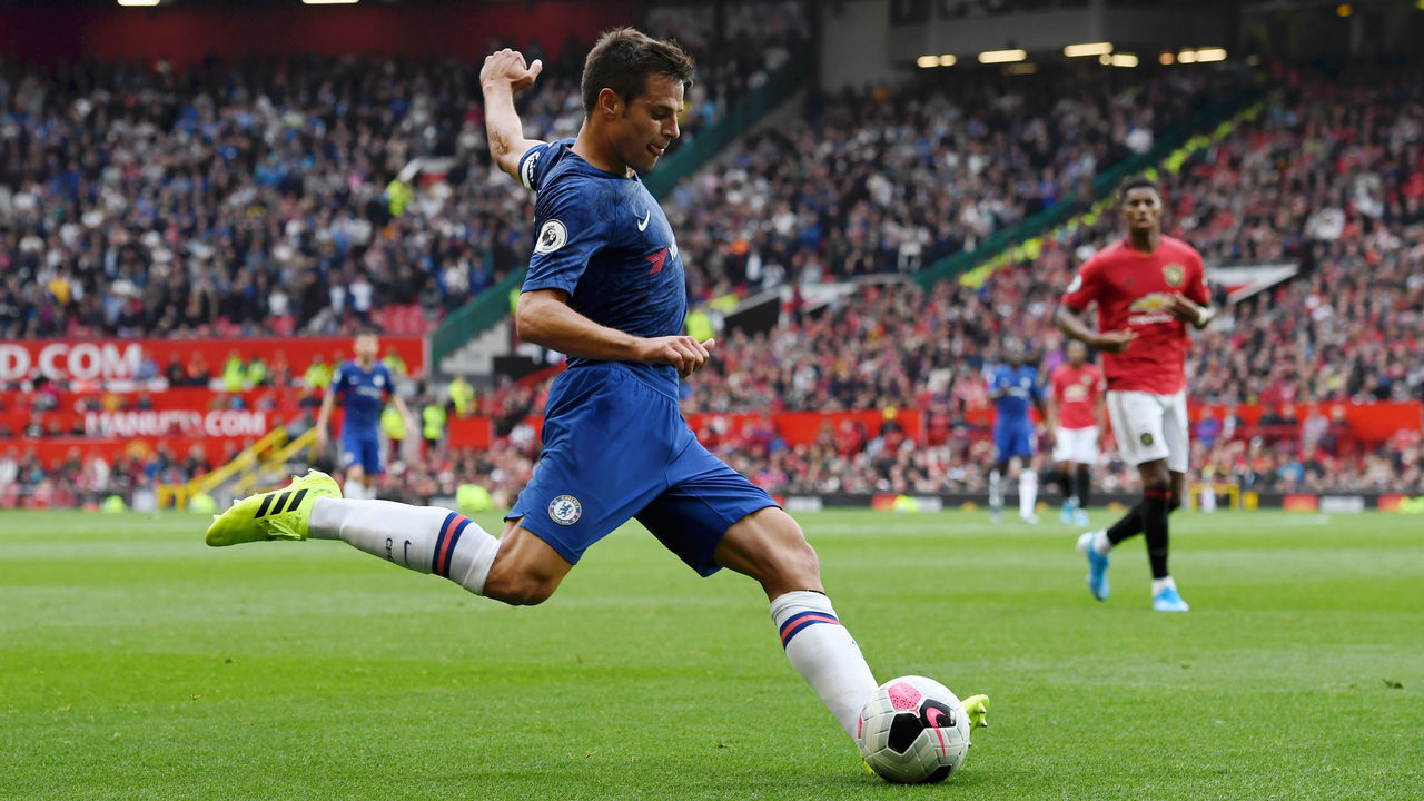 MANCHESTER, ENGLAND - AUGUST 11: Cesar Azpilicueta of Chelsea strikes the ball during the Premier League match between Manchester United and Chelsea FC at Old Trafford on August 11, 2019 in Manchester, United Kingdom.