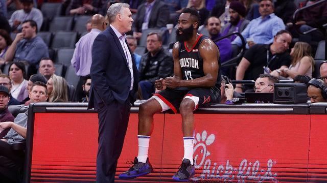 SACRAMENTO, CA - APRIL 02: James Harden #13 of the Houston Rockets sits on the scorers table talking to head coach Mike D'Antoni during a timeout from the game against the Sacramento Kings at Golden 1 Center on April 2, 2019 in Sacramento, California.