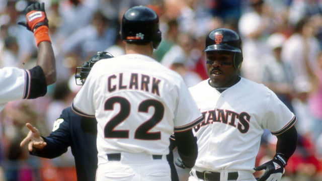 SAN FRANCISCO, CA - CIRCA 1989: Kevin Mitchell #7 of the San Francisco Giants is congratulated by Will Clark #22 after Mitchell hit a home run during a Major League Baseball game circa 1989 at Candlestick Park in San Francisco, California. Mitchell played for the Giants in 1987-91.
