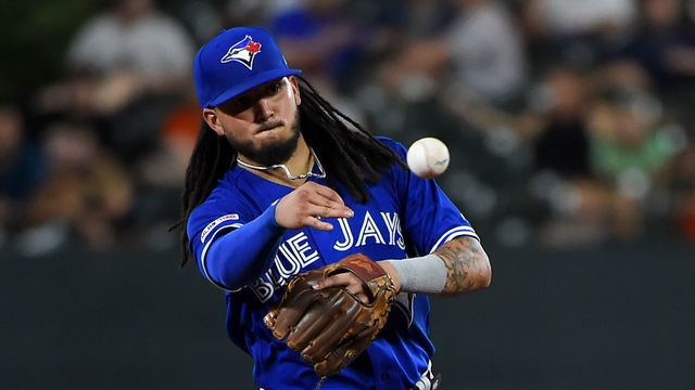 BALTIMORE, MD - AUGUST 02: Freddy Galvis #16 of the Toronto Blue Jays throws to first base during the game against the Baltimore Orioles at Oriole Park at Camden Yards on August 2, 2019 in Baltimore, Maryland.