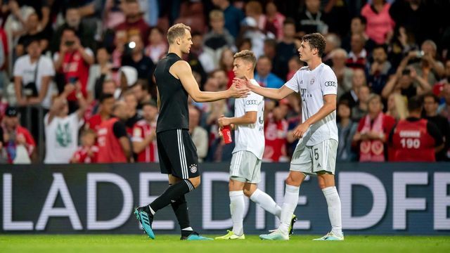 COTTBUS, GERMANY - AUGUST 12: Manuel Neuer (L) of Muenchen celebrates with Benjamin Pavard after the DFB Cup first round match between Energie Cottbus and FC Bayern Muenchen at Stadion der Freundschaft on August 12, 2019 in Cottbus, Germany.