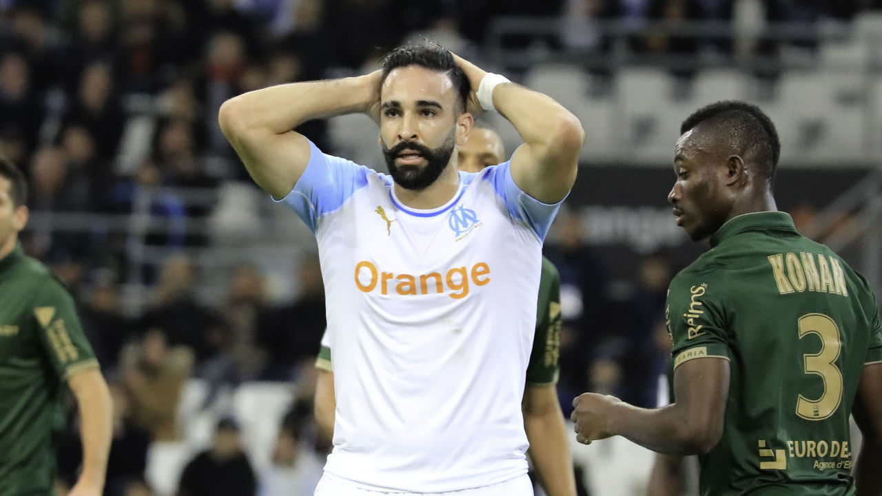 MARSEILLE, FRANCE - DECEMBER 02: Adil Rami of Olympique de Marseille runs with the ball during the Ligue 1 match between Olympique de Marseille and Reims at Stade Velodrome on December 2, 2018 in Marseille, France.
