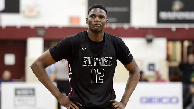 MIDDLE VILLAGE, NEW YORK - APRIL 04: N’Faly Dante #12 of Sunrise Christian Academy looks on against IMG Academy in the quarterfinal of the GEICO High School National Tournament at Christ the King High School on April 04, 2019 in Middle Village, New York.