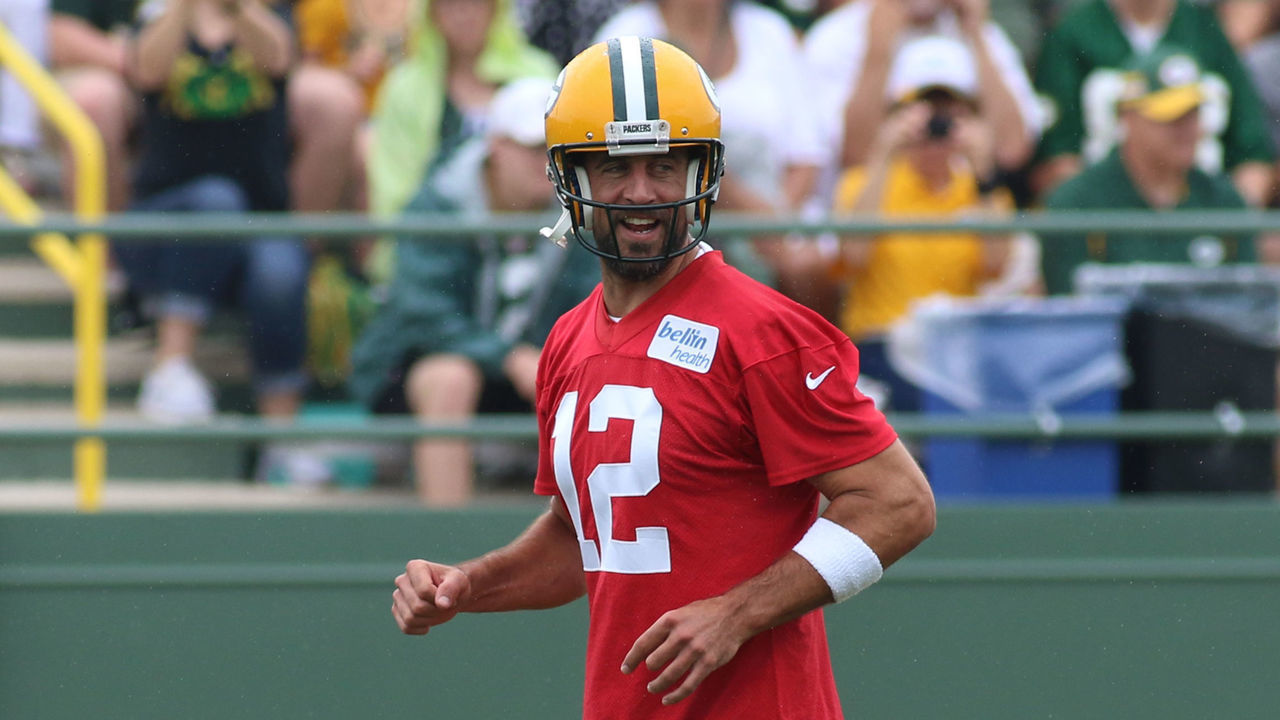 ASHWAUBENON, WI - JULY 26: Green Bay Packers quarterback Aaron Rodgers (12) laughs while jogging downfield during Green Bay Packers Training Camp at Ray Nitschke Field on July 26, 2019 in Ashwaubenon, WI.