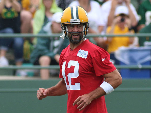 ASHWAUBENON, WI - JULY 26: Green Bay Packers quarterback Aaron Rodgers (12) laughs while jogging downfield during Green Bay Packers Training Camp at Ray Nitschke Field on July 26, 2019 in Ashwaubenon, WI.