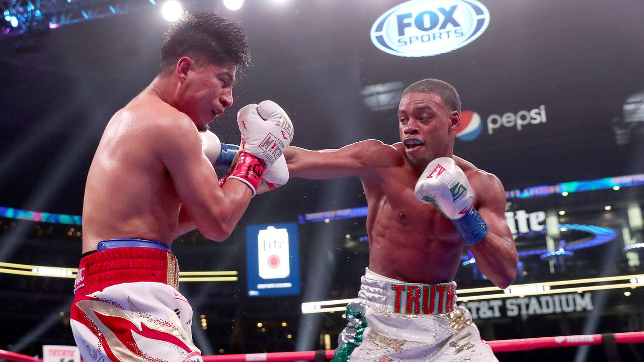 ARLINGTON, TEXAS - MARCH 16: (R-L) Errol Spence Jr fights Mikey Garcia in an IBF World Welterweight Championship bout at AT&T Stadium on March 16, 2019 in Arlington, Texas.