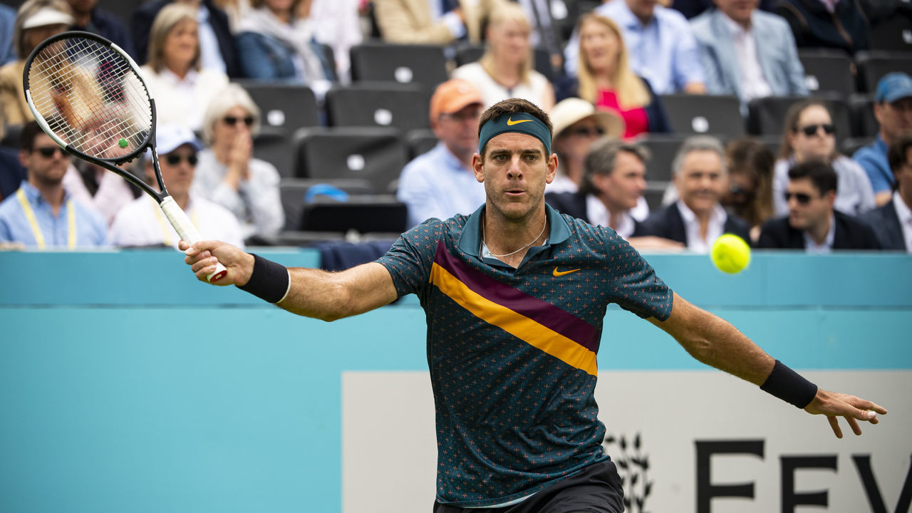 LONDON, ENGLAND - JUNE 19: Juan Martin Del Potro of Argentina hits a forehand against Denis Shapovalov of Canada in the first round of the men’s singles during day 3 of the Fever-Tree Championships at Queens Club on June 19, 2019 in London, United Kingdom.