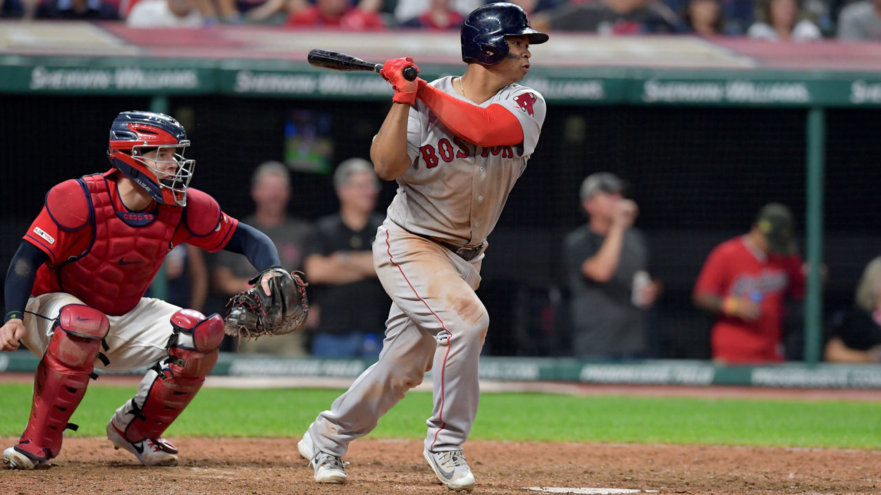 CLEVELAND, OHIO - AUGUST 13: Rafael Devers #11 of the Boston Red Sox hits a double during the tenth inning against the Cleveland Indians at Progressive Field on August 13, 2019 in Cleveland, Ohio.