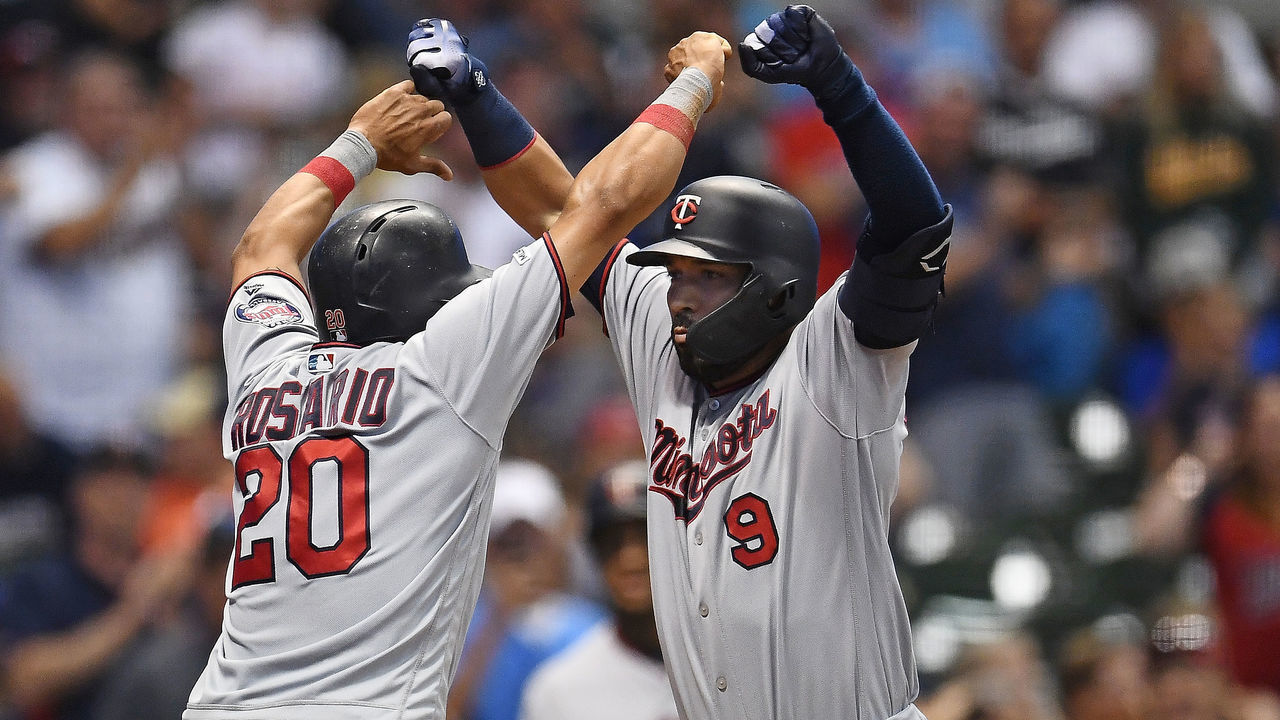 MILWAUKEE, WISCONSIN - AUGUST 13: Marwin Gonzalez #9 of the Minnesota Twins is congratulated by Eddie Rosario #20 following a three run home run against the Milwaukee Brewers during the eighth inning at Miller Park on August 13, 2019 in Milwaukee, Wisconsin.
