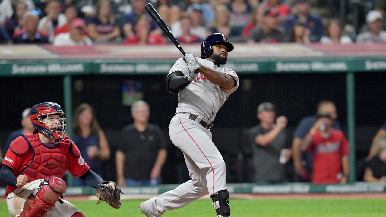 CLEVELAND, OHIO - AUGUST 13: Jackie Bradley Jr. #19 of the Boston Red Sox hits a solo homer to take the lead during the tenth inning against the Cleveland Indians at Progressive Field on August 13, 2019 in Cleveland, Ohio.