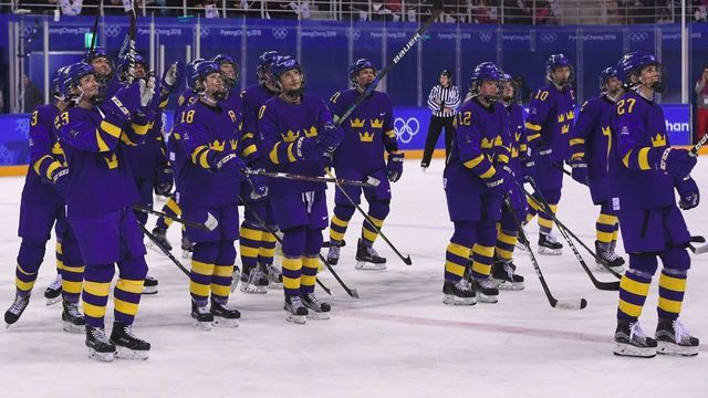 Team Sweden celebrates their winning against the Unified Korea team after their women's play-off classifications (7-8) ice hockey match between the Unified Korea team and Sweden during the Pyeongchang 2018 Winter Olympic Games at the Kwandong Hockey Centre in Gangneung on February 20, 2018. / AFP PHOTO / Jung Yeon-je