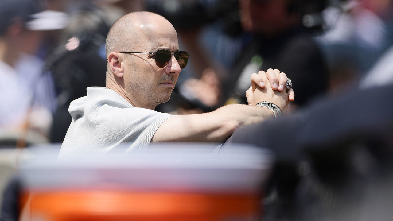NEW YORK, NY - AUGUST 12: General Manager of the New York Yankees Brian Cashman is seen in the dugout prior to the game against the Texas Rangers at Yankee Stadium on August 12, 2018 in the Bronx borough of New York City.