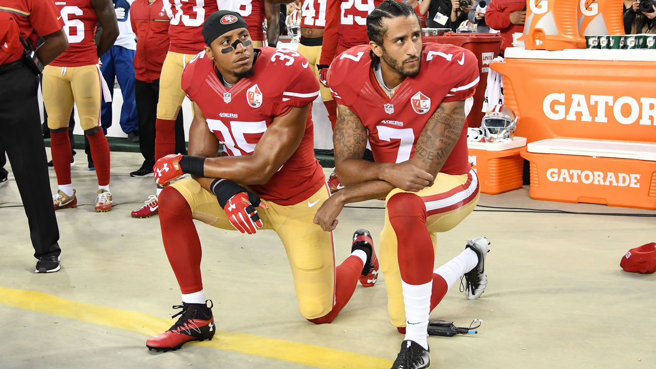 SANTA CLARA, CA - SEPTEMBER 12: Colin Kaepernick #7 and Eric Reid #35 of the San Francisco 49ers kneel in protest during the national anthem prior to playing the Los Angeles Rams in their NFL game at Levi's Stadium on September 12, 2016 in Santa Clara, California.