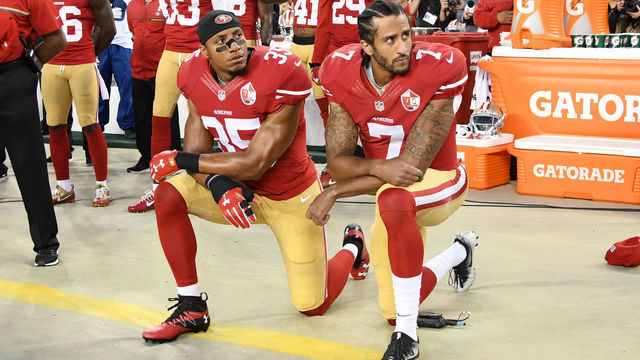 SANTA CLARA, CA - SEPTEMBER 12: Colin Kaepernick #7 and Eric Reid #35 of the San Francisco 49ers kneel in protest during the national anthem prior to playing the Los Angeles Rams in their NFL game at Levi's Stadium on September 12, 2016 in Santa Clara, California.