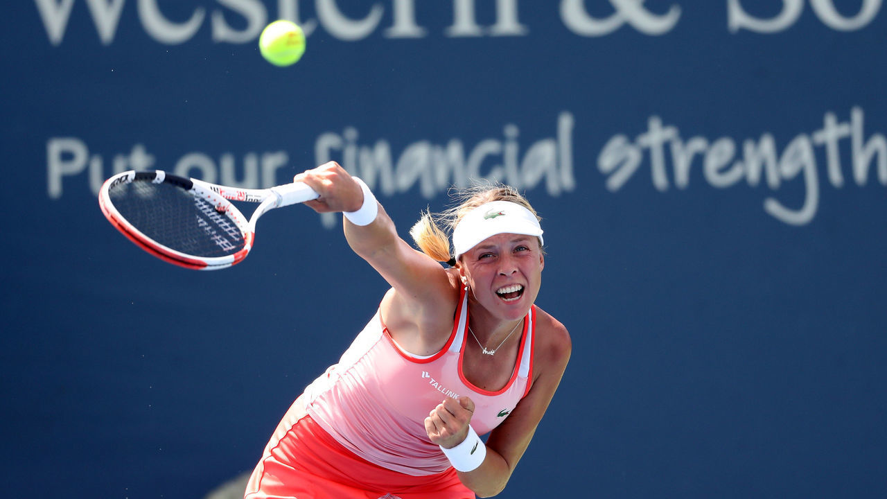 MASON, OHIO - AUGUST 15: Anett Kontaveit of Estonia returns a shot to Ashleigh Barty of Australia during Day 6 of the Western and Southern Open at Lindner Family Tennis Center on August 15, 2019 in Mason, Ohio.