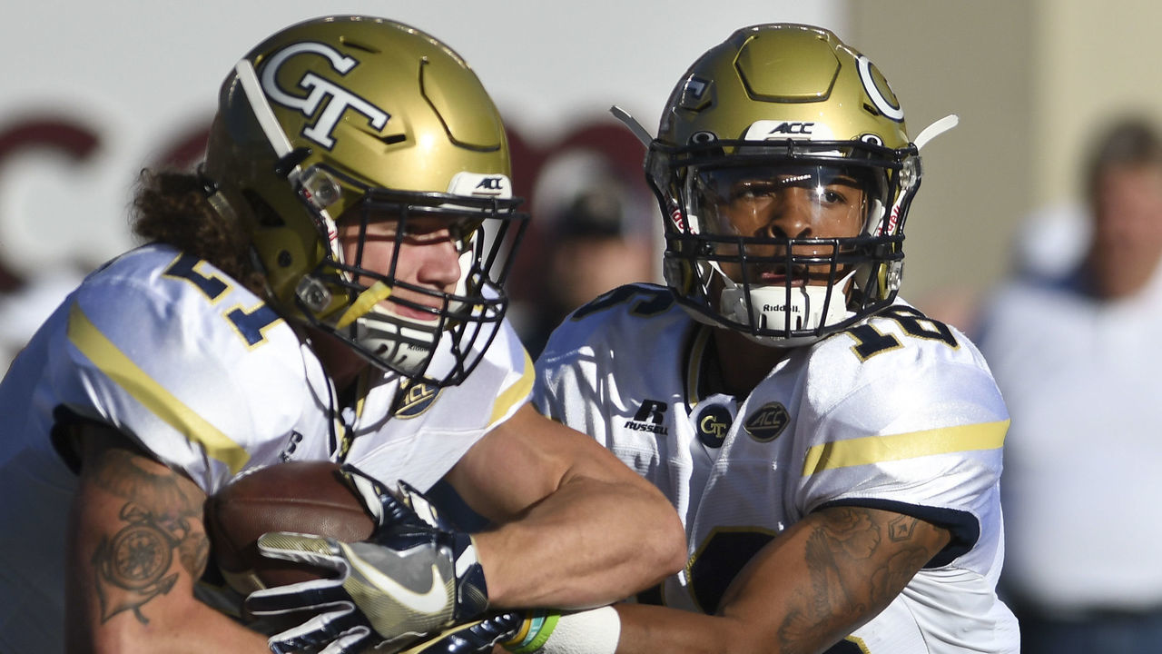 BLACKSBURG, VA - NOVEMBER 12: Running back Quaide Weimerskirch #21 of the Georgia Tech Yellow Jackets receives the ball from quarterback Lucas Johnson #18 prior to the game against the Virginia Tech Hokies at Lane Stadium on November 12, 2016 in Blacksburg, Virginia. Georgia Tech defeated Virginia Tech 30-20.