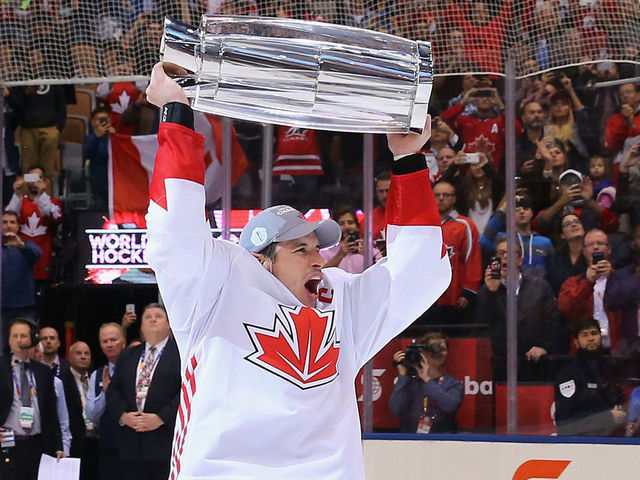 TORONTO, ON - SEPTEMBER 29: Sidney Crosby #87 of Team Canada carries the World Cup of Hockey Trophy after Canada defeated Europe 2-1 during Game Two of the World Cup of Hockey final series at the Air Canada Centre on September 29, 2016 in Toronto, Canada.