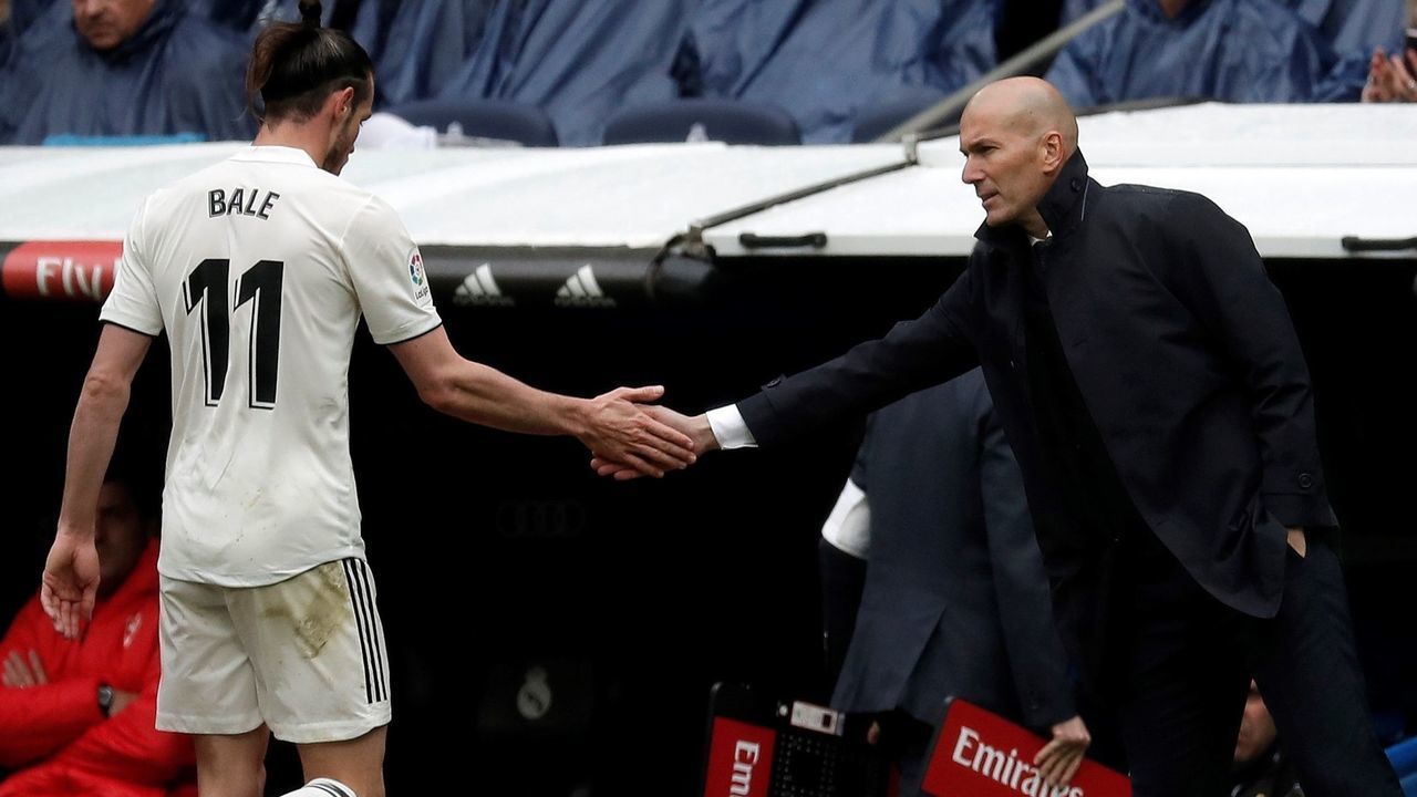 MADRID, SPAIN - APRIL 6: Head Coach of Real Madrid Zinedine Zidane (R) congratulates his player Gareth Bale (11) during La Liga match between Real Madrid and Eibar at Santiago Bernabeu in Madrid, Spain on April 6, 2019.