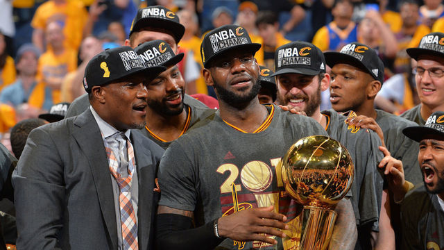 OAKLAND, CA - JUNE 19: LeBron James #23 of the Cleveland Cavaliers gets ready to handle the NBA championship trophy against the Golden State Warriors during the 2016 NBA Finals Game Seven on June 19, 2016 at ORACLE Arena in Oakland, California. Mandatory Copyright Notice: Copyright 2016 NBAE