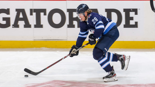 WINNIPEG, MB - APRIL 12: Patrik Laine #29 of the Winnipeg Jets plays the puck down the ice during third period action against the St. Louis Blues in Game Two of the Western Conference First Round during the 2019 NHL Stanley Cup Playoffs at the Bell MTS Place on April 12, 2019 in Winnipeg, Manitoba, Canada. The Blues defeated the Jets 4-3 to lead the series 2-0.