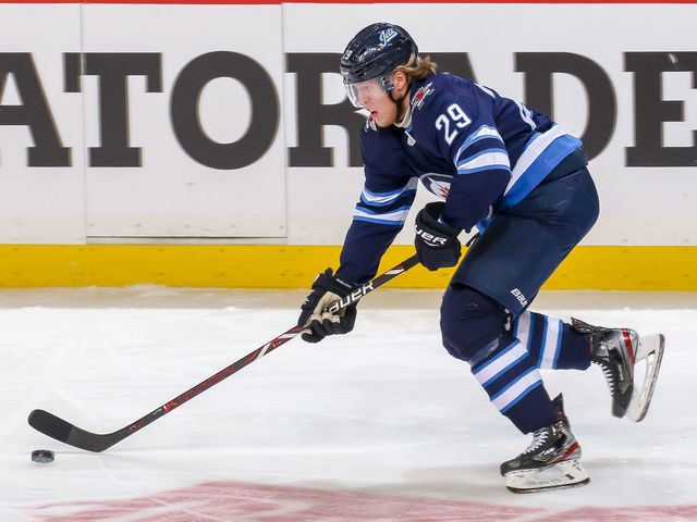 WINNIPEG, MB - APRIL 12: Patrik Laine #29 of the Winnipeg Jets plays the puck down the ice during third period action against the St. Louis Blues in Game Two of the Western Conference First Round during the 2019 NHL Stanley Cup Playoffs at the Bell MTS Place on April 12, 2019 in Winnipeg, Manitoba, Canada. The Blues defeated the Jets 4-3 to lead the series 2-0.