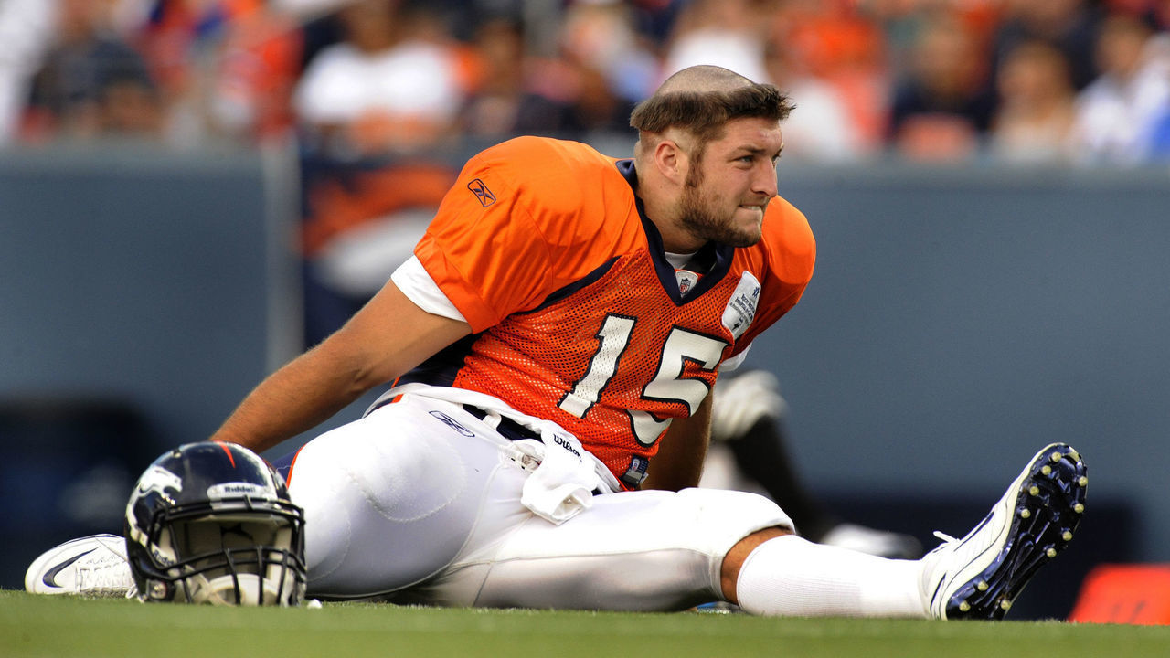Denver Broncos quarterback Tim Tebow showed off his rookie haircut bestowed on him Saturday afternoon before practice. The Denver Broncos held a practice session at Invesco Field Saturday afternoon, August 7, 2010. The crowd was announced at more than 20,000. Karl Gehring, The Denver Post