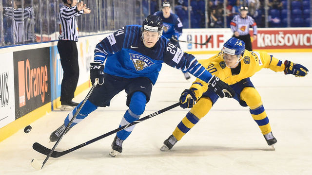 KOSICE, May 24, 2019 -- Elias Pettersson (R) of Sweden tackles Kaapo Kakko of Finland during the 2019 IIHF Ice Hockey World Championship Slovakia quarter final game between Finland and Sweden at Steel Arena on May 23, 2019 in Kosice, Slovakia. Finland won 5-4 after overtime. (Xinhua/Lukasz Laskowski via Getty Images)