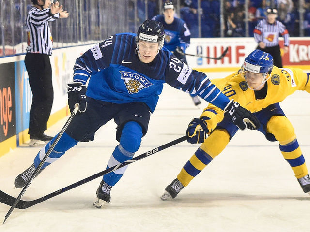 KOSICE, May 24, 2019 -- Elias Pettersson (R) of Sweden tackles Kaapo Kakko of Finland during the 2019 IIHF Ice Hockey World Championship Slovakia quarter final game between Finland and Sweden at Steel Arena on May 23, 2019 in Kosice, Slovakia. Finland won 5-4 after overtime. (Xinhua/Lukasz Laskowski via Getty Images)