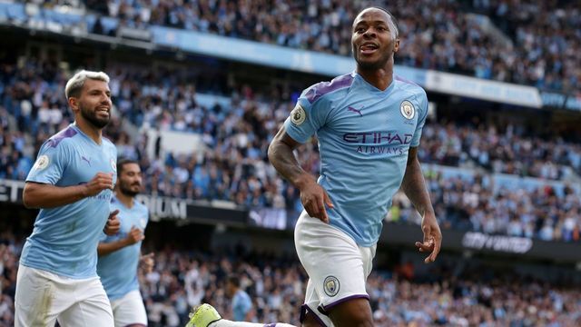 Manchester City's English midfielder Raheem Sterling (R) celebrates scoring his team's first goal during the English Premier League football match between Manchester City and Tottenham Hotspur at the Etihad Stadium in Manchester, north west England, on August 17, 2019.