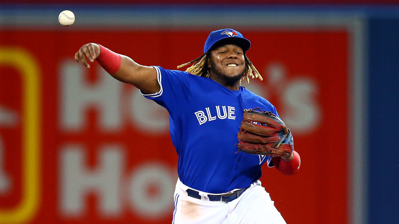 TORONTO, ON - AUGUST 17: Vladimir Guerrero Jr. #27 of the Toronto Blue Jays throws to first base as Austin Nola #23 the Seattle Mariners singles in the second inning during a MLB game at Rogers Centre on August 17, 2019 in Toronto, Canada.