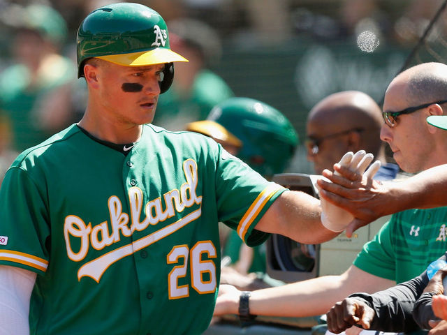 Chapman, Canha back Bassitt in A's 8-4 win over Astros