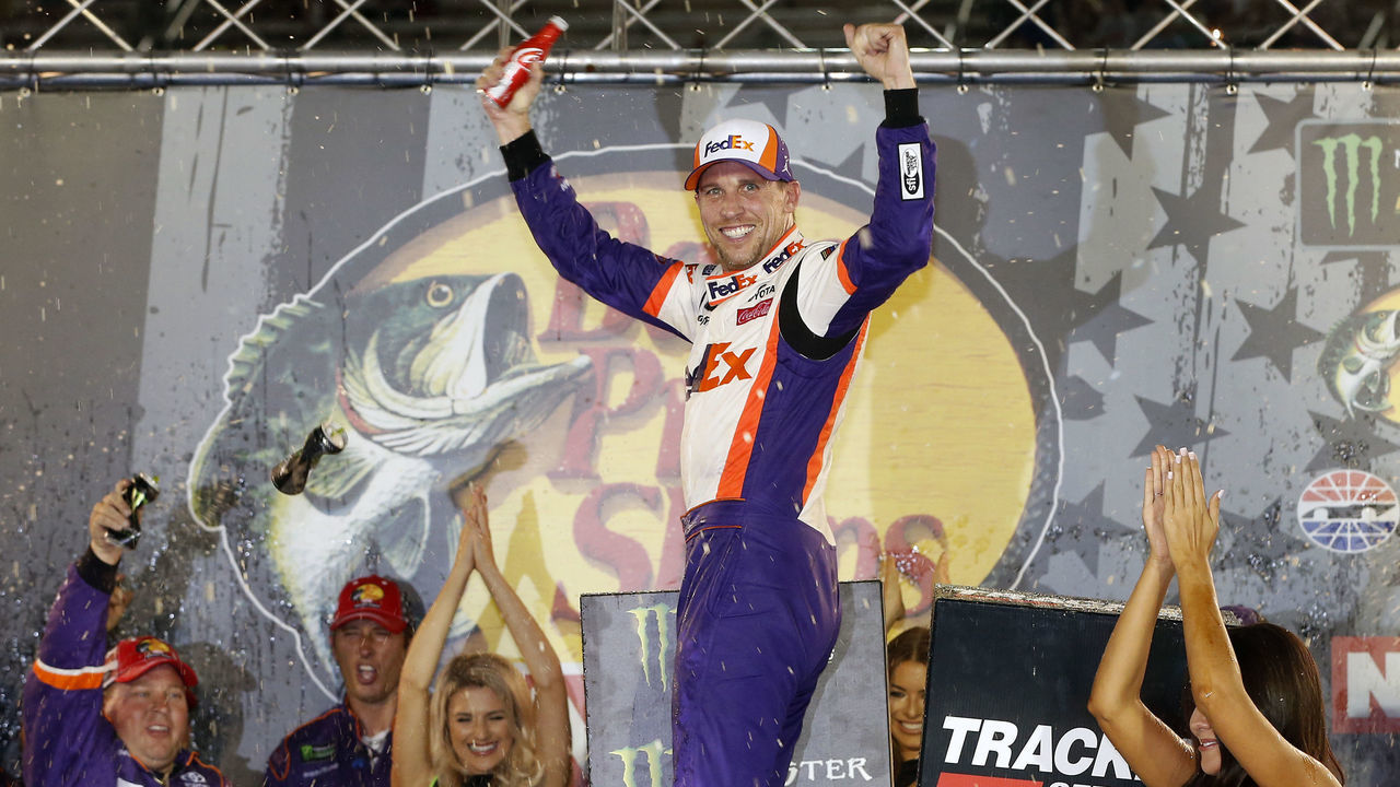 BRISTOL, TENNESSEE - AUGUST 17: Denny Hamlin, driver of the #11 FedEx Freight Toyota, celebrates in Victory Lane after winning the Monster Energy NASCAR Cup Series Bass Pro Shops NRA Night Race at Bristol Motor Speedway on August 17, 2019 in Bristol, Tennessee.