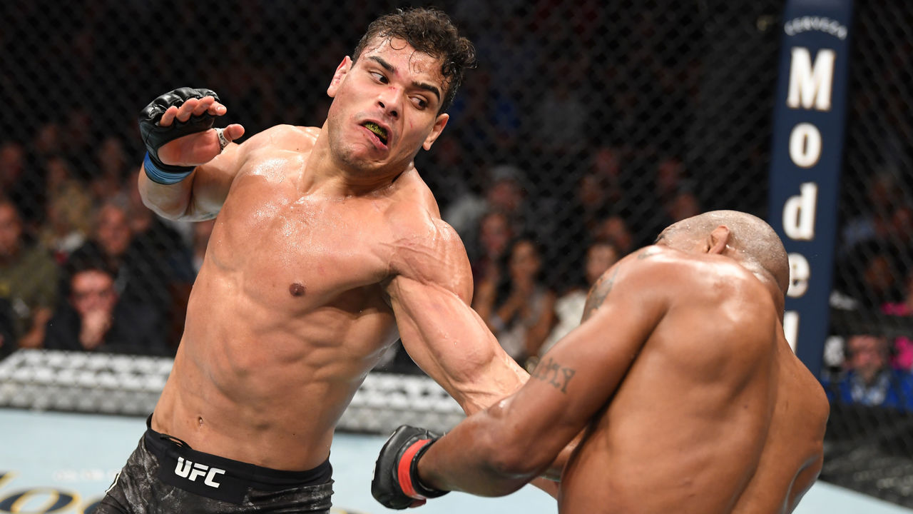 ANAHEIM, CALIFORNIA - AUGUST 17: (L-R) Paulo Costa of Brazil punches Yoel Romero of Cuba in their middleweight bout during the UFC 241 event at the Honda Center on August 17, 2019 in Anaheim, California.