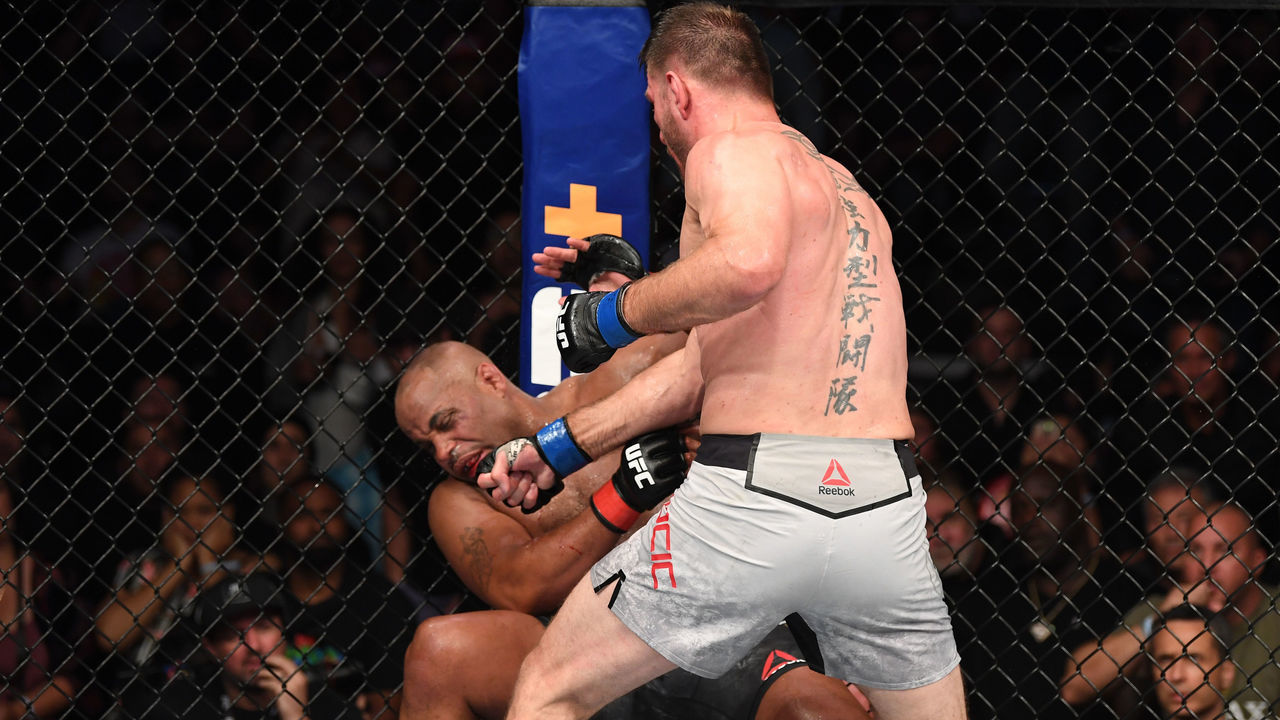 ANAHEIM, CALIFORNIA - AUGUST 17: (R-L) Stipe Miocic punches Daniel Cormier in their heavyweight championship bout during the UFC 241 event at the Honda Center on August 17, 2019 in Anaheim, California.