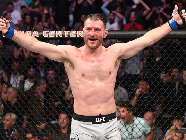 ANAHEIM, CALIFORNIA - AUGUST 17: Stipe Miocic celebrates his TKO victory over Daniel Cormier in their heavyweight championship bout during the UFC 241 event at the Honda Center on August 17, 2019 in Anaheim, California.
