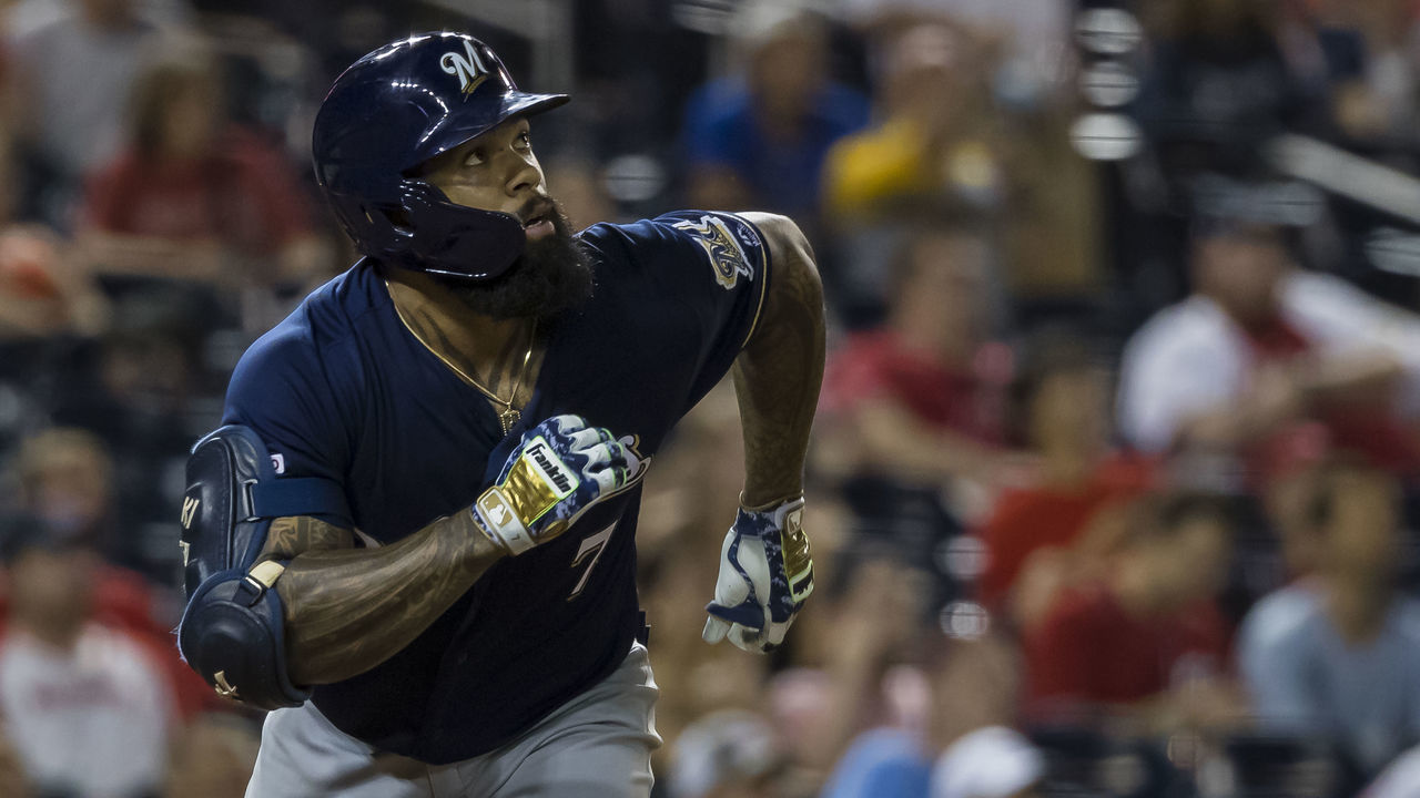 WASHINGTON, DC - AUGUST 17: Eric Thames #7 of the Milwaukee Brewers hits a two-run home run against the Washington Nationals during the fourteenth inning at Nationals Park on August 17, 2019 in Washington, DC.