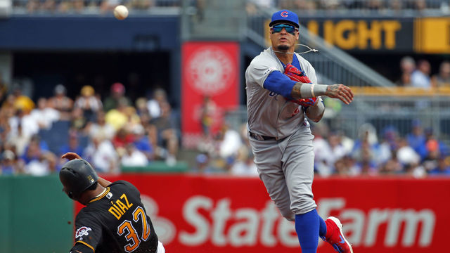 PITTSBURGH, PA - AUGUST 17: Javier Baez #9 of the Chicago Cubs turns a double play against the Pittsburgh Pirates in the second inning at PNC Park on August 17, 2019 in Pittsburgh, Pennsylvania.