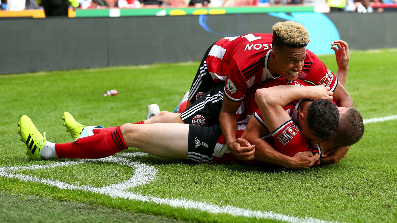 SHEFFIELD, ENGLAND - AUGUST 18: John Lundstram of Sheffield United celebrates after scoring a goal to make it 1-0 during the Premier League match between Sheffield United and Crystal Palace at Bramall Lane on August 18, 2019 in Sheffield, United Kingdom.