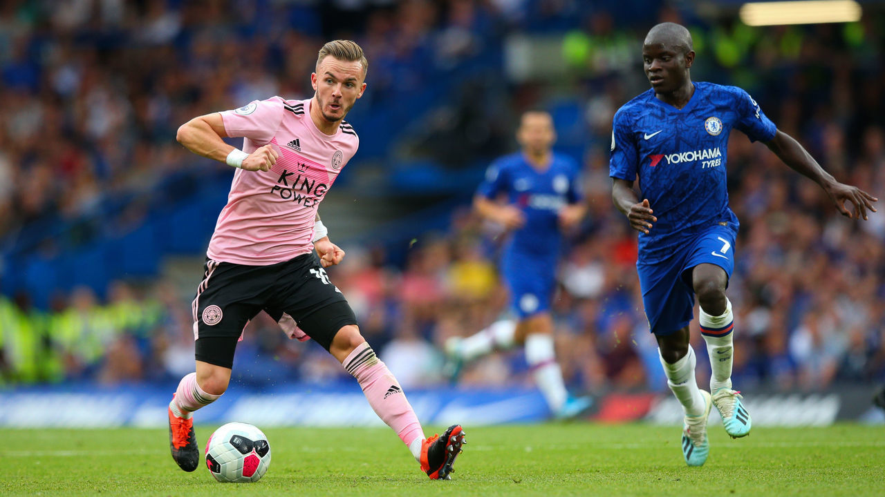 LONDON, ENGLAND - AUGUST 18: James Maddison of Leicester City holds off the challenge from NGolo Kante of Chelsea during the Premier League match between Chelsea FC and Leicester City at Stamford Bridge on August 18, 2019 in London, United Kingdom.