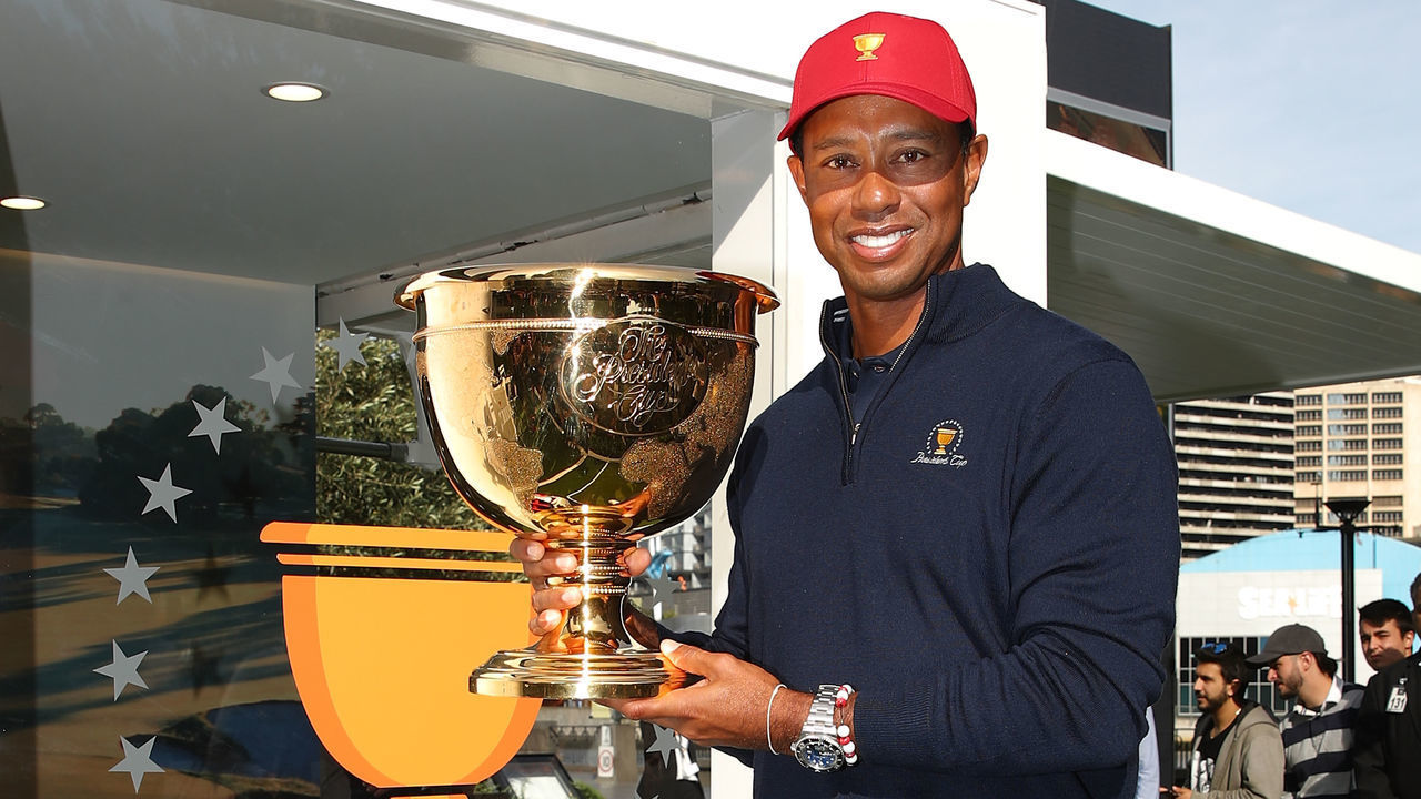 MELBOURNE, AUSTRALIA - DECEMBER 06: Tiger Woods poses with the Presidents Cup during a Presidents Cup media opportunity at the Yarra Promenade on December 5, 2018 in Melbourne, Australia. The Presidents Cup 2019 will be held on December 9-15, 2019, when it returns to the prestigious Royal Melbourne Golf Club in Australia.