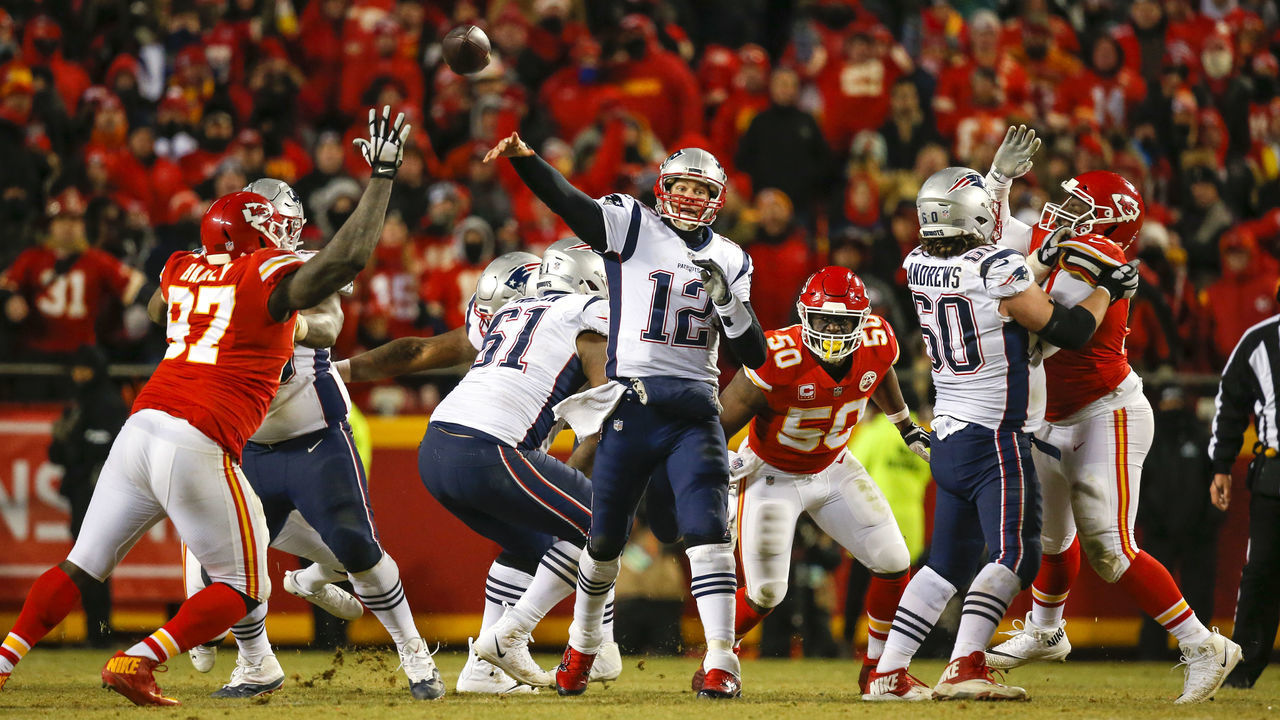 KANSAS CITY, MO - JANUARY 20: Quarterback Tom Brady #12 of the New England Patriots throws a pass against the Kansas City Chiefs in overtime during the AFC Championship Game at Arrowhead Stadium on January 20, 2019 in Kansas City, Missouri.
