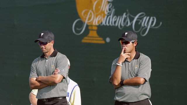 INCHEON CITY, SOUTH KOREA - OCTOBER 08: Adam Scott of Australia and Hideki Matsuyama of Japan and the International Team wait on the 16th green during the Thursday foursomes matches at The Presidents Cup at Jack Nicklaus Golf Club Korea on October 8, 2015 in Songdo IBD, Incheon City, South Korea