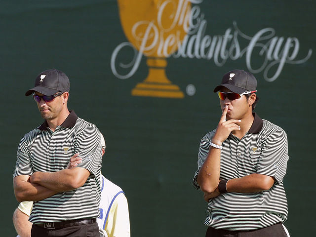 INCHEON CITY, SOUTH KOREA - OCTOBER 08: Adam Scott of Australia and Hideki Matsuyama of Japan and the International Team wait on the 16th green during the Thursday foursomes matches at The Presidents Cup at Jack Nicklaus Golf Club Korea on October 8, 2015 in Songdo IBD, Incheon City, South Korea