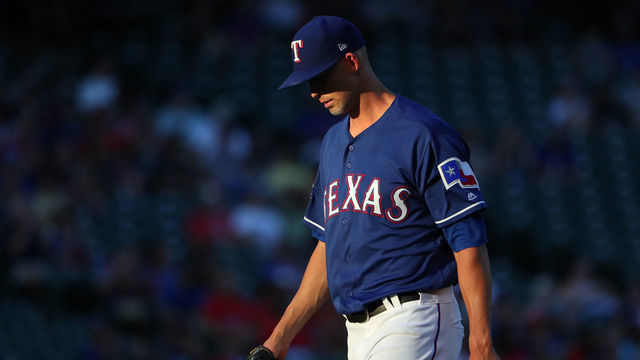 ARLINGTON, TEXAS - AUGUST 16: Mike Minor #23 of the Texas Rangers walks off the mound after closing out the top of the first inning against the Minnesota Twins at Globe Life Park in Arlington on August 16, 2019 in Arlington, Texas.