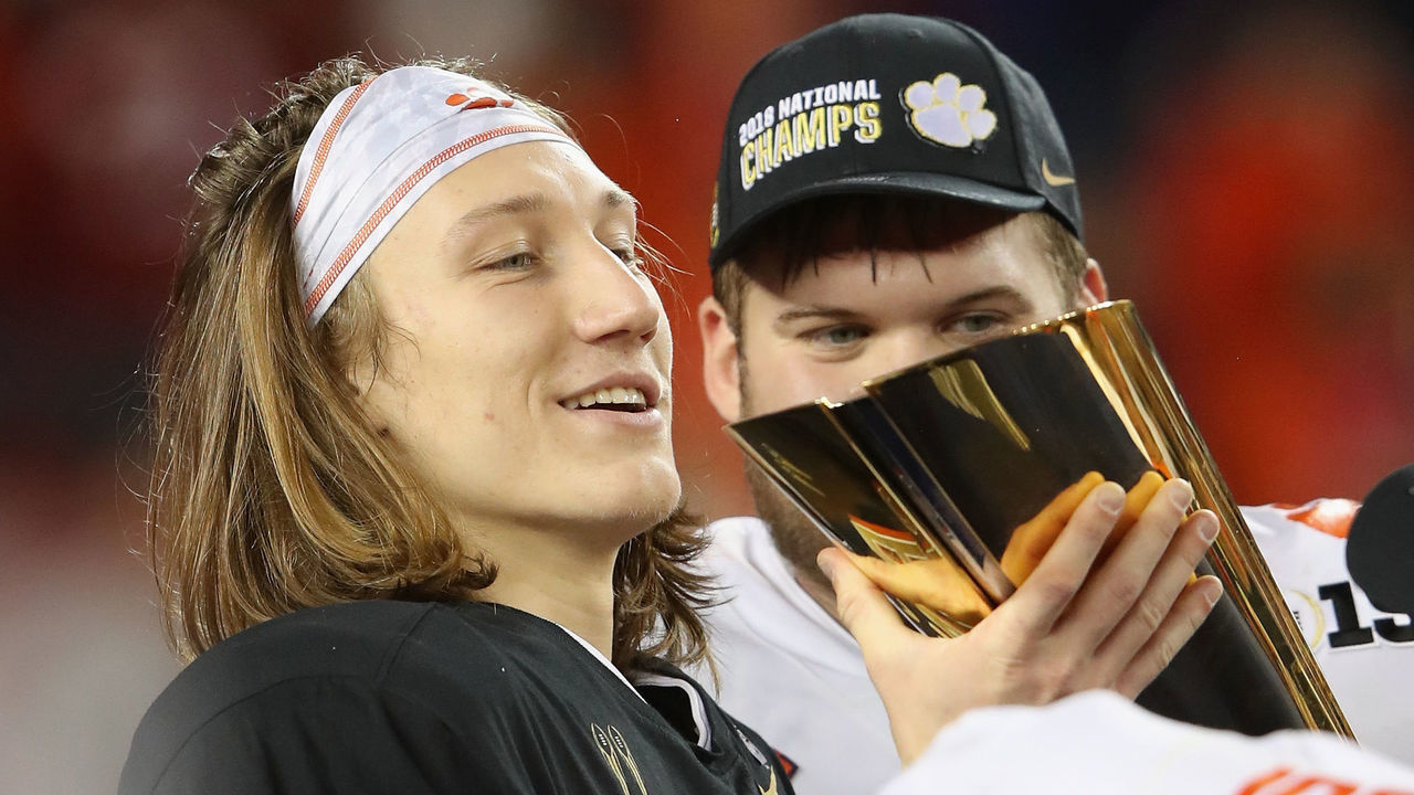 SANTA CLARA, CA - JANUARY 07: Trevor Lawrence #16 of the Clemson Tigers celebrates with the trophy after his teams 44-16 win over the Alabama Crimson Tide in the CFP National Championship presented by AT&T at Levi's Stadium on January 7, 2019 in Santa Clara, California.