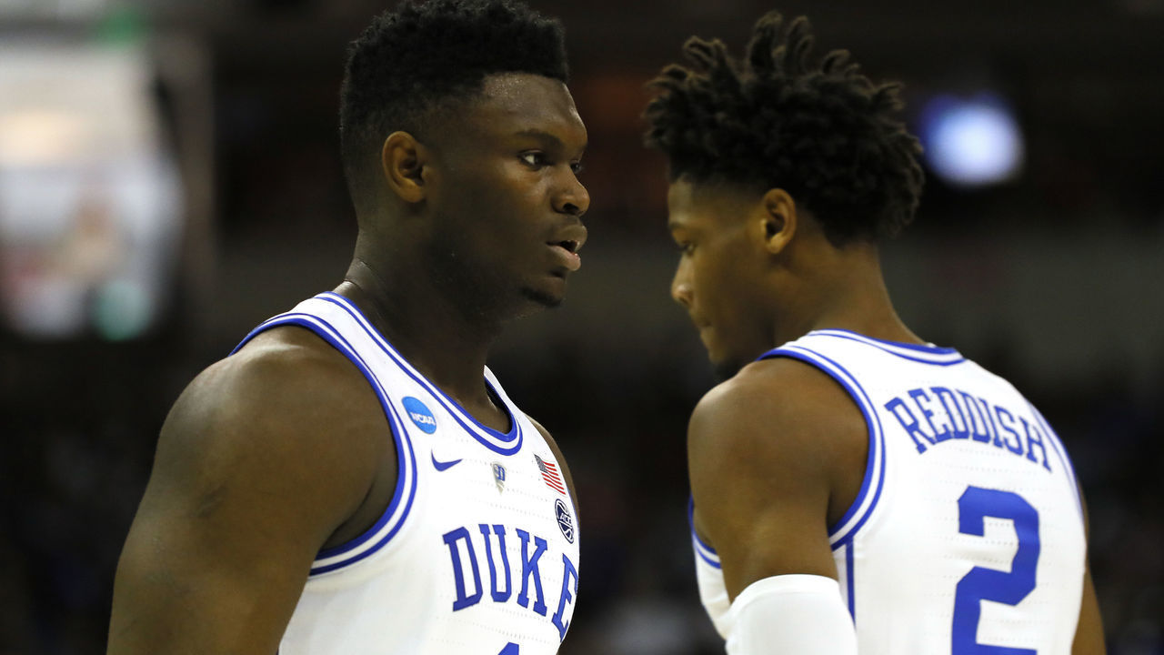 COLUMBIA, SOUTH CAROLINA - MARCH 24: Zion Williamson #1 of the Duke Blue Devils talks with Cam Reddish #2 against the UCF Knights during the first half in the second round game of the 2019 NCAA Men's Basketball Tournament at Colonial Life Arena on March 24, 2019 in Columbia, South Carolina.