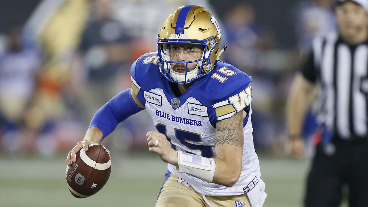 HAMILTON, ON - JULY 26: Matt Nichols #15 of the Winnipeg Blue Bombers rolls out to pass against the Hamilton Tiger-Cats at Tim Hortons Field on July 26, 2019 in Hamilton, Canada. Hamilton defeated Winnipeg 23-15.