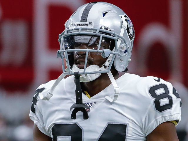 Oakland Raiders wide receiver Antonio Brown (84) puts on his helmet prior  to an NFL football ga …